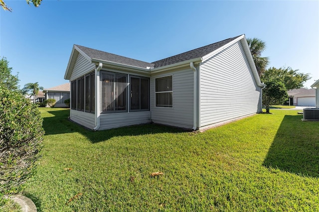 1312 Landeros Ln, The Villages, FL 32159 - exterior space featuring a sunroom, roof with shingles, a yard, and cooling unit