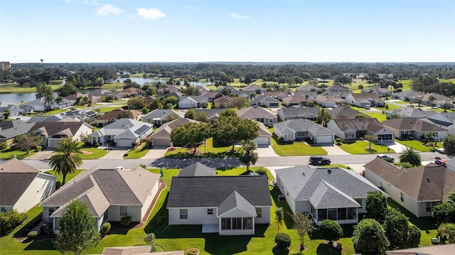 1312 Landeros Ln, The Villages, FL 32159 - drone / aerial view featuring a water view and a residential view