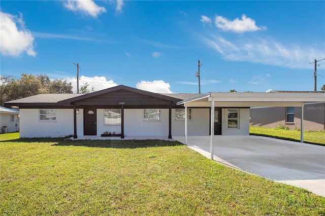 ranch-style house featuring a front lawn and a carport