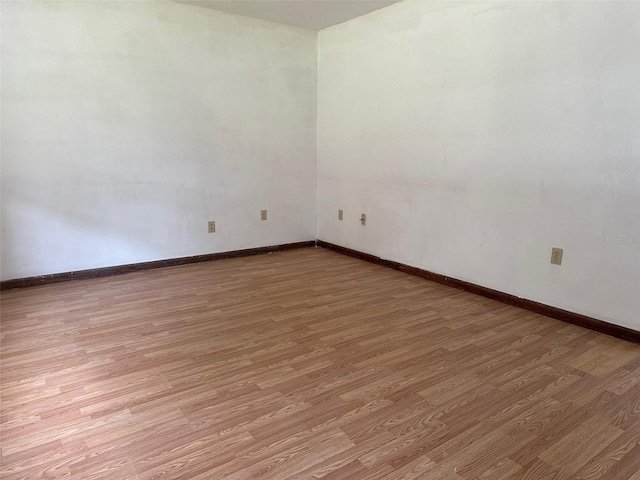 unfurnished room featuring hardwood / wood-style flooring