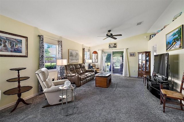 living room featuring lofted ceiling, ceiling fan, and dark colored carpet