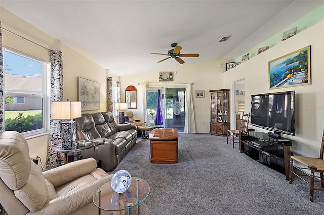 living room featuring ceiling fan, lofted ceiling, and carpet floors