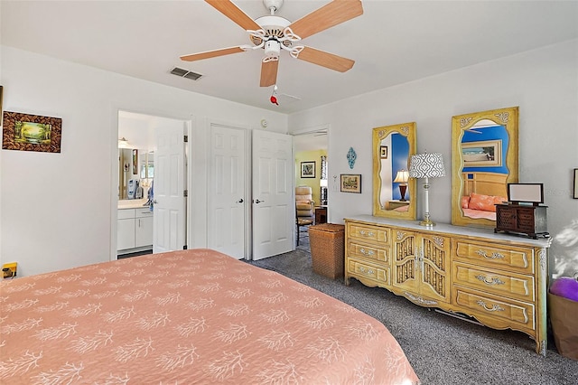 carpeted bedroom with connected bathroom and ceiling fan