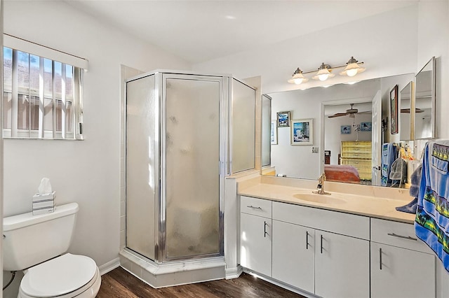 bathroom with vanity, toilet, an enclosed shower, and hardwood / wood-style floors