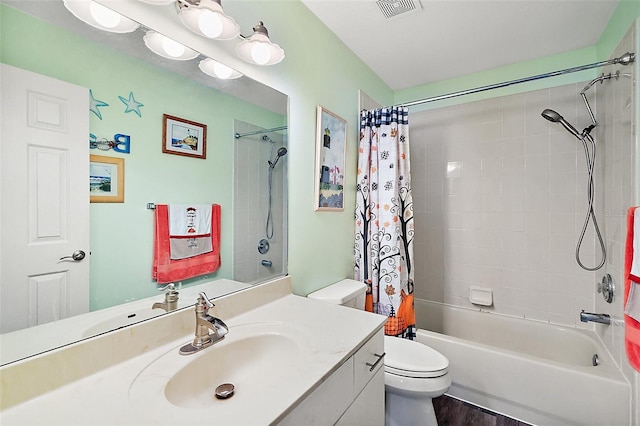 full bathroom with vanity, toilet, shower / tub combo with curtain, and hardwood / wood-style floors