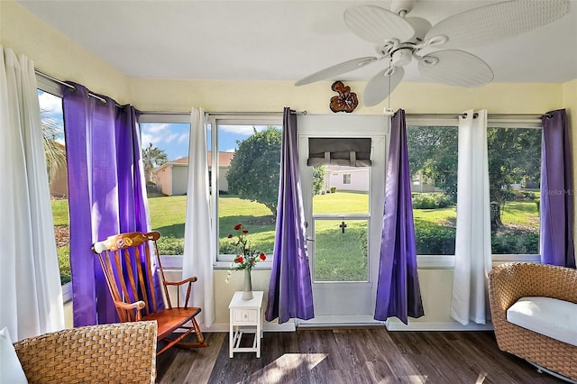 sunroom featuring ceiling fan and a wealth of natural light