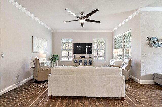 living area featuring baseboards, ceiling fan, ornamental molding, and wood tiled floor