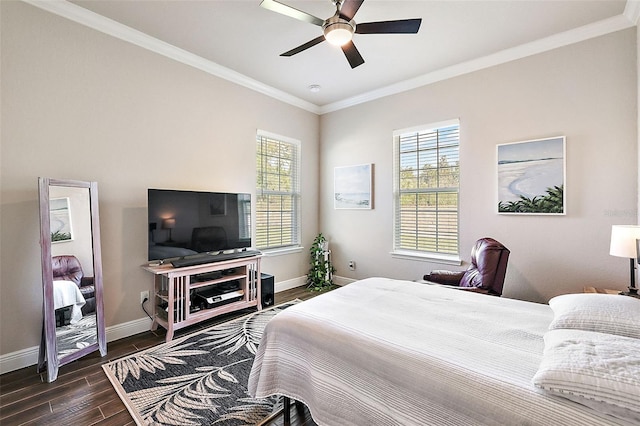 bedroom with dark wood-type flooring, ceiling fan, and crown molding