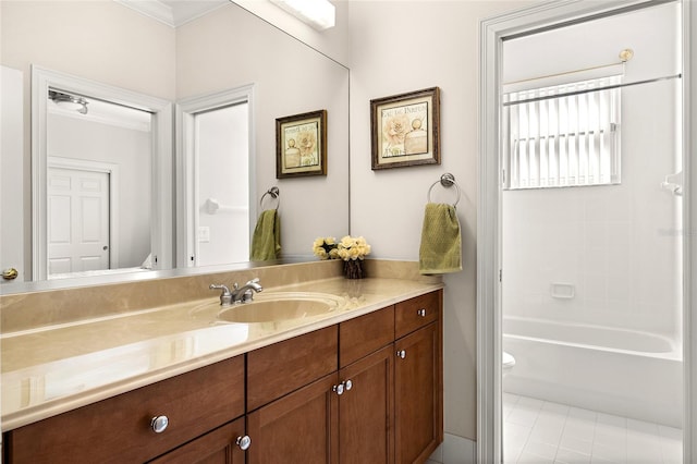 full bathroom featuring crown molding,  shower combination, vanity, tile patterned floors, and toilet