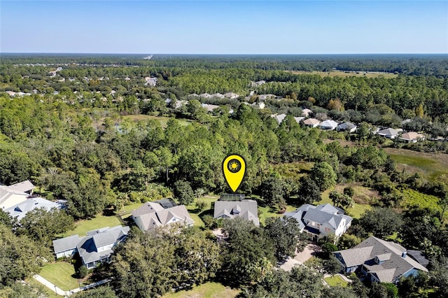 bird's eye view with a forest view and a residential view