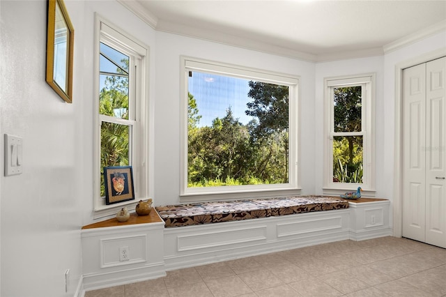 unfurnished room with light tile patterned flooring and ornamental molding