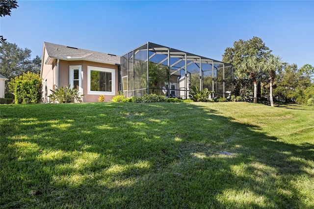 view of yard with a lanai