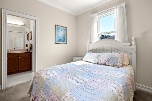 bedroom featuring ornamental molding, ensuite bathroom, baseboards, and carpet floors