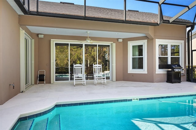 outdoor pool featuring a patio, grilling area, a lanai, and ceiling fan