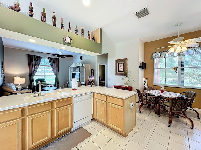 kitchen featuring sink, kitchen peninsula, white dishwasher, ceiling fan, and light tile patterned floors