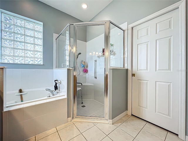 bathroom featuring independent shower and bath and tile patterned flooring