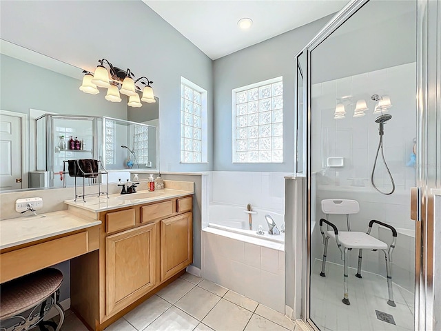 bathroom with vanity, tile patterned floors, and plus walk in shower