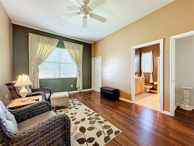 living area featuring ceiling fan and wood-type flooring