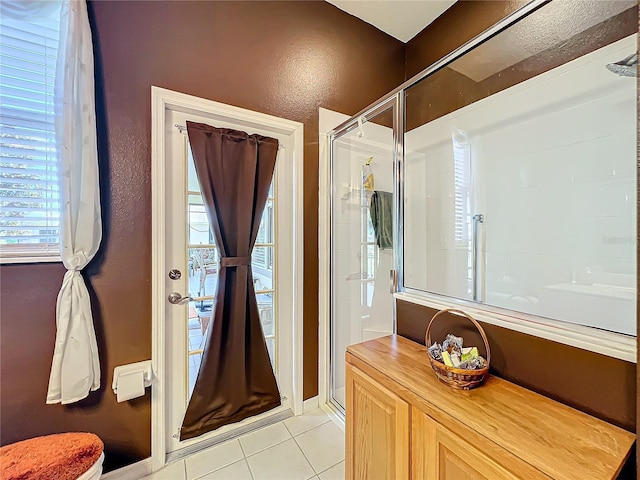 bathroom featuring walk in shower and tile patterned floors