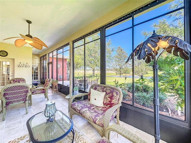 sunroom featuring ceiling fan