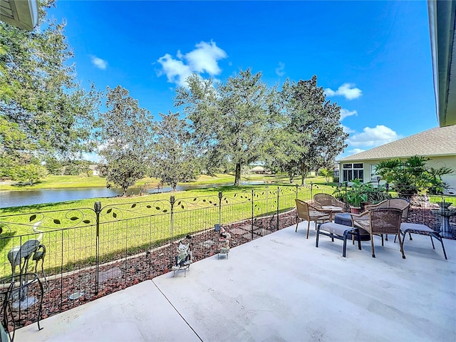 view of patio with a water view