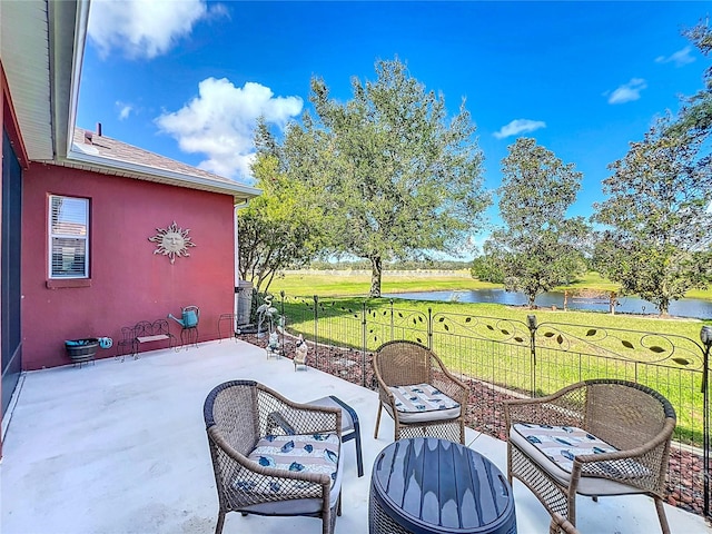 view of patio / terrace with a water view