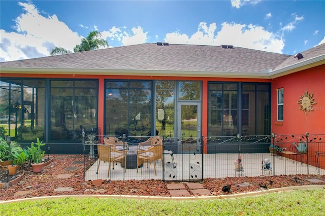 exterior space featuring a sunroom and a patio area