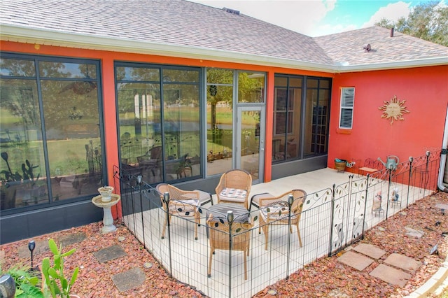 view of patio / terrace with a sunroom