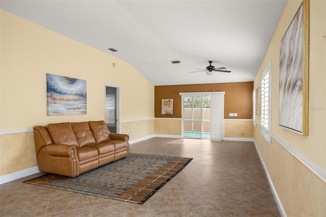 living room with lofted ceiling, tile patterned floors, and ceiling fan