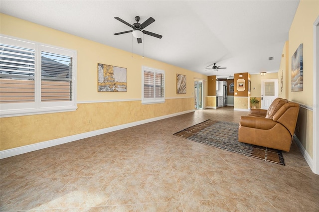 unfurnished living room with vaulted ceiling and ceiling fan