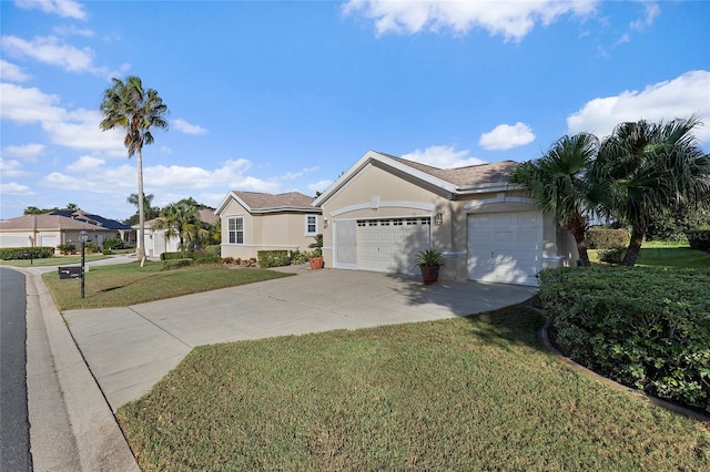 ranch-style home with a front lawn and a garage