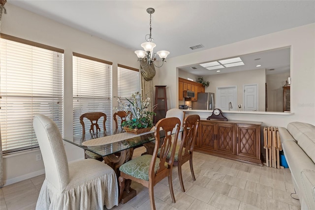 dining room with a chandelier