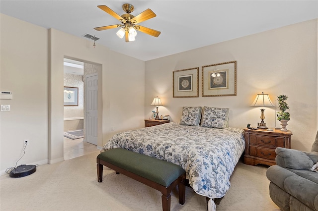 carpeted bedroom with connected bathroom and ceiling fan