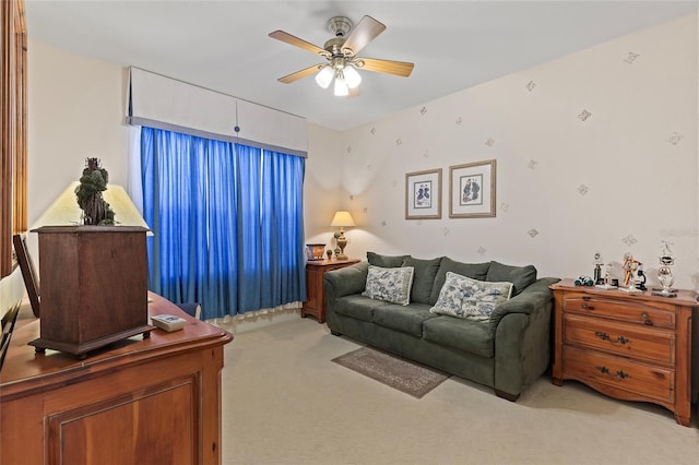 living room with ceiling fan and light colored carpet