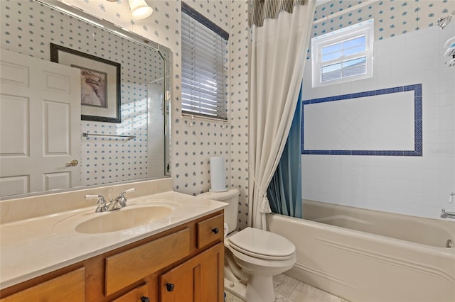 full bathroom with vanity, shower / tub combo, and toilet