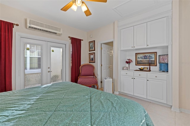 tiled bedroom featuring a wall mounted air conditioner, french doors, and ceiling fan