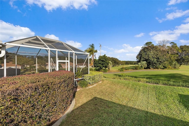 view of yard with glass enclosure