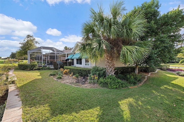 view of yard featuring a lanai