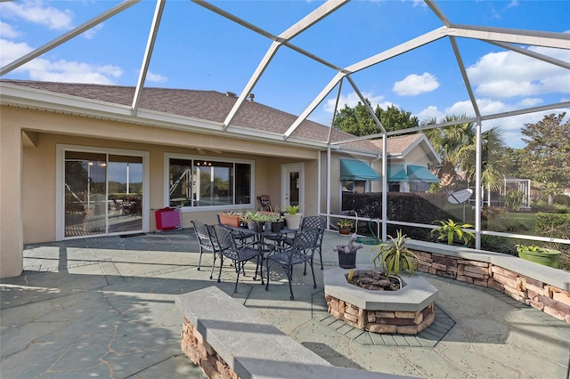 view of patio with glass enclosure