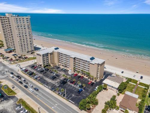 aerial view with a view of the beach and a water view