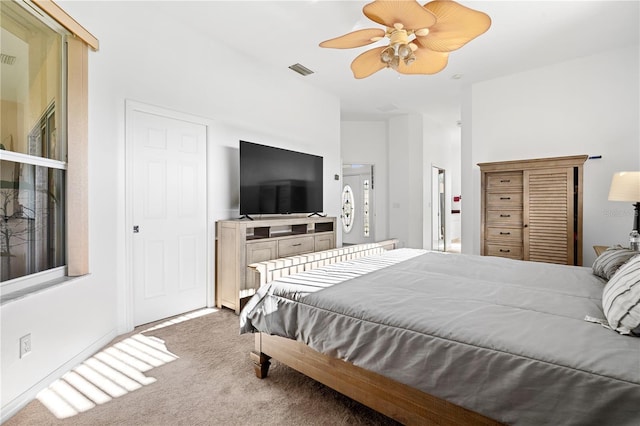 carpeted bedroom featuring ceiling fan