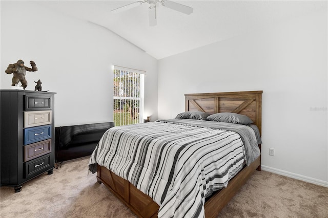 carpeted bedroom with ceiling fan and vaulted ceiling