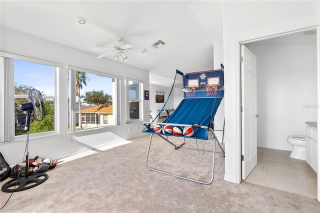 playroom with light colored carpet and ceiling fan