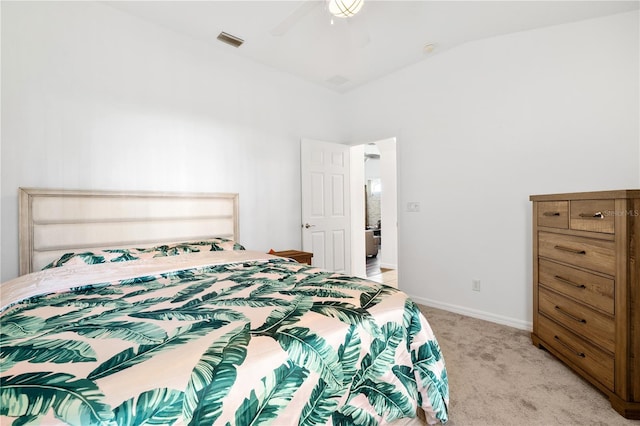 bedroom featuring lofted ceiling, light colored carpet, and ceiling fan