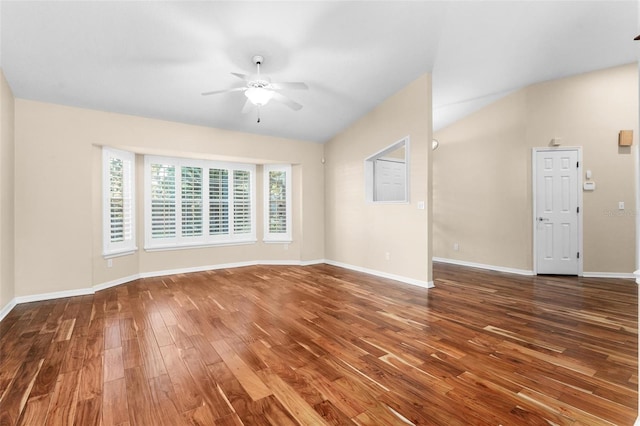 empty room with lofted ceiling, dark wood-type flooring, and ceiling fan