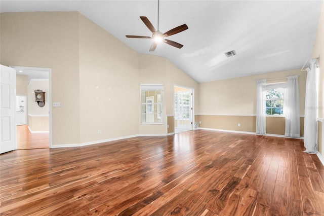 empty room featuring high vaulted ceiling, wood-type flooring, and ceiling fan