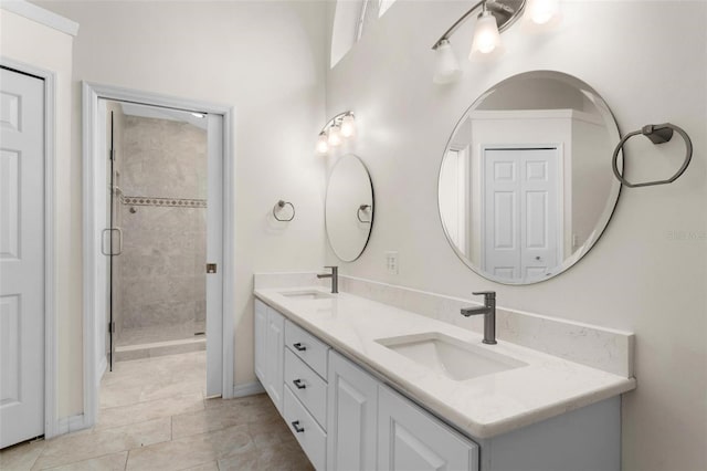 bathroom with vanity, tile patterned floors, and walk in shower