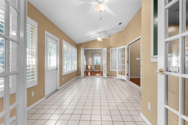 interior space with vaulted ceiling and ceiling fan