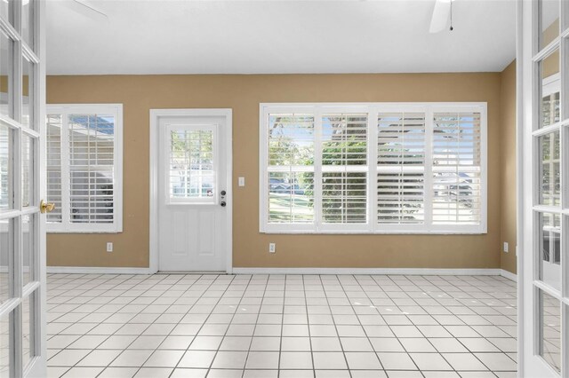 interior space featuring french doors and ceiling fan