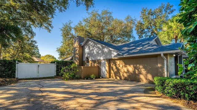 view of side of property featuring a garage